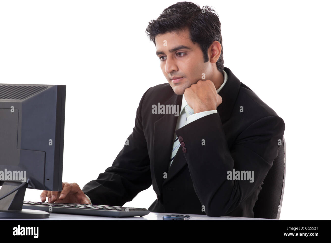 Indian businessman working on computer hi-res stock photography and ...