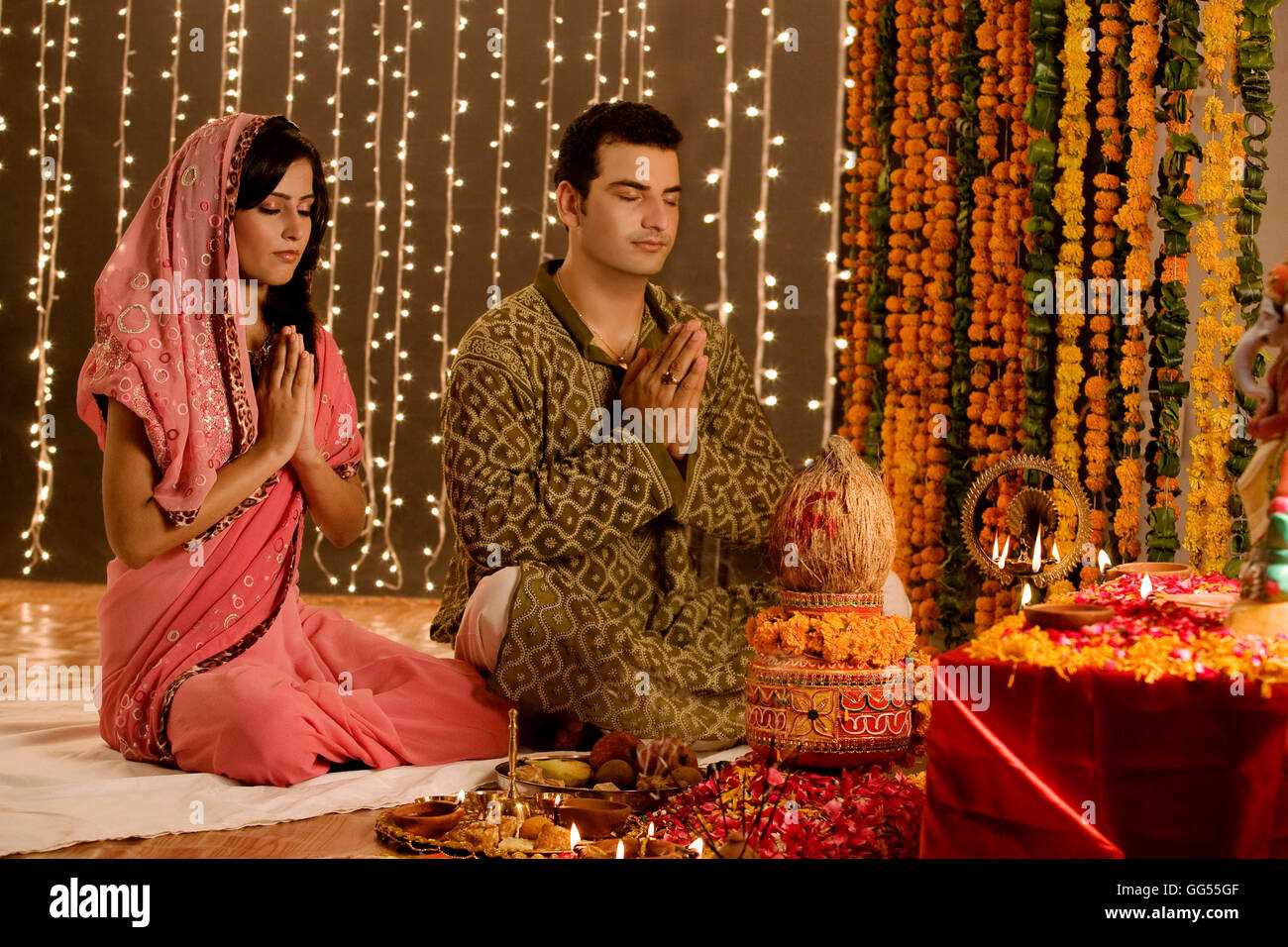 Couple performing a pooja Stock Photo