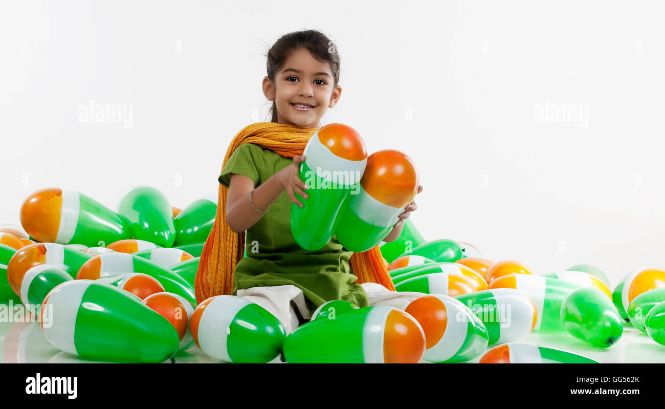 Girl sitting with balloons Stock Photo
