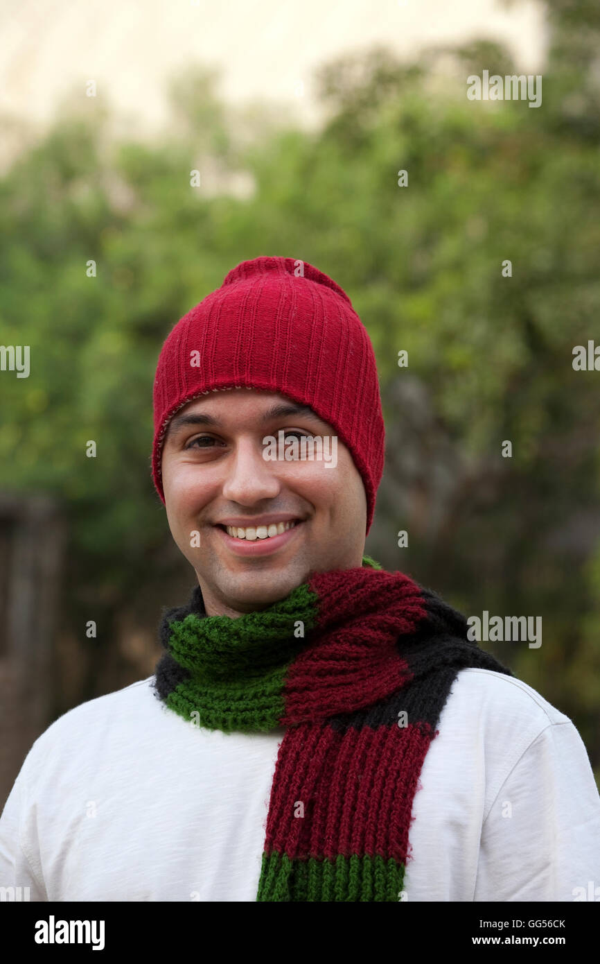Portrait of smiling young man in winter clothes Stock Photo - Alamy