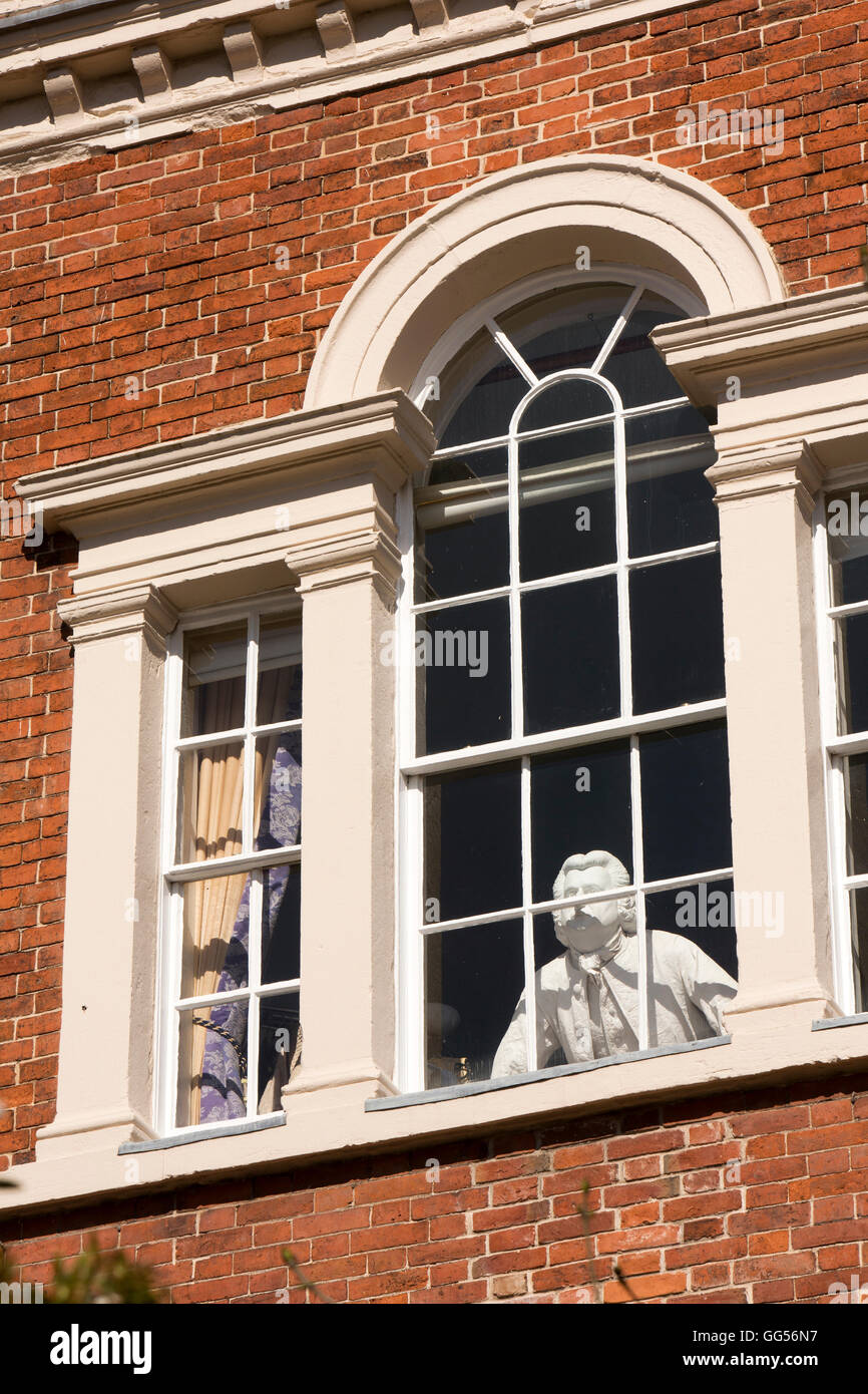 UK, England, Staffordshire, Lichfield, Beacon Street, Erasmus Darwin House, figure in museum upper floor window Stock Photo