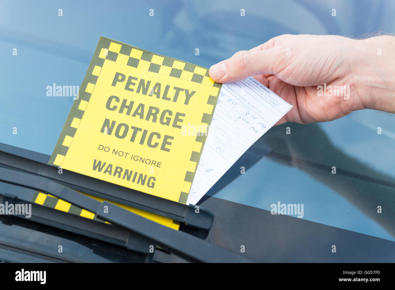 Parking ticket placed under windshield wiper Stock Photo Alamy