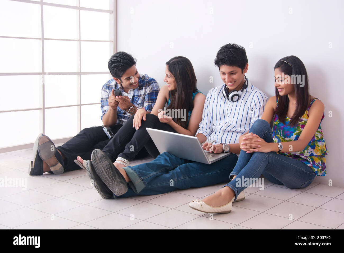 Full length of friends spending leisure time together in college Stock Photo