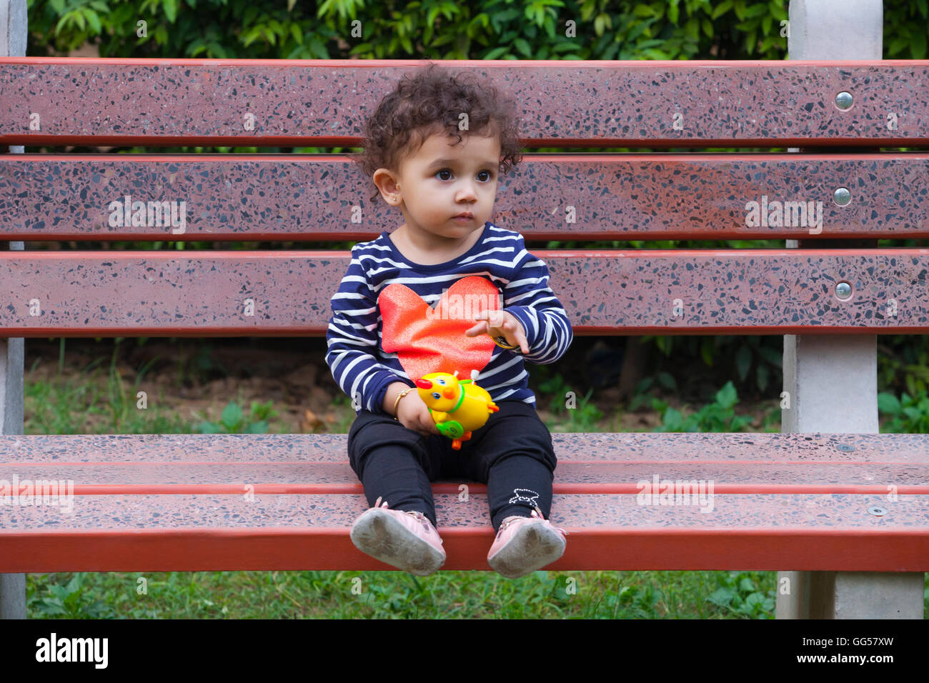 Indian girl sitting on bench hi-res stock photography and images - Alamy