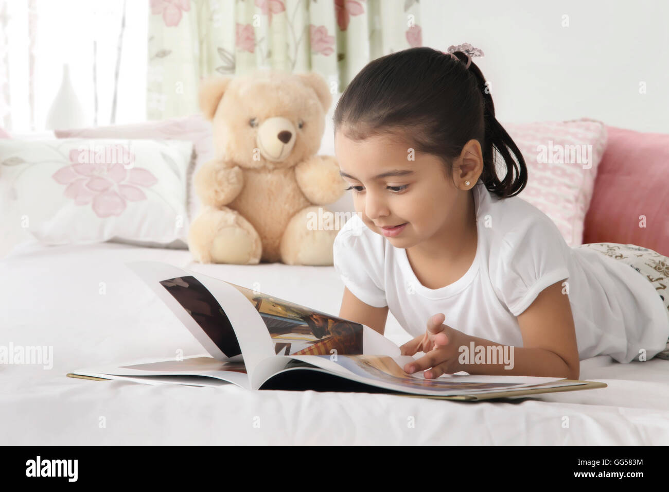 Indian girl reading book hi-res stock photography and images - Alamy