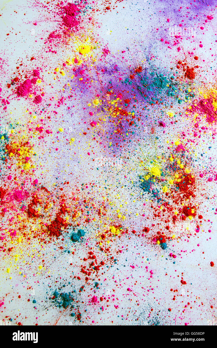 Multi-colored powder paint spread over white background Stock Photo - Alamy