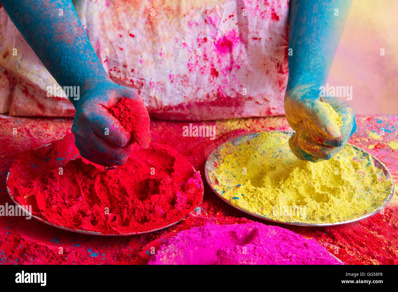 Midsection of person holding powder paints during Holi festival Stock Photo