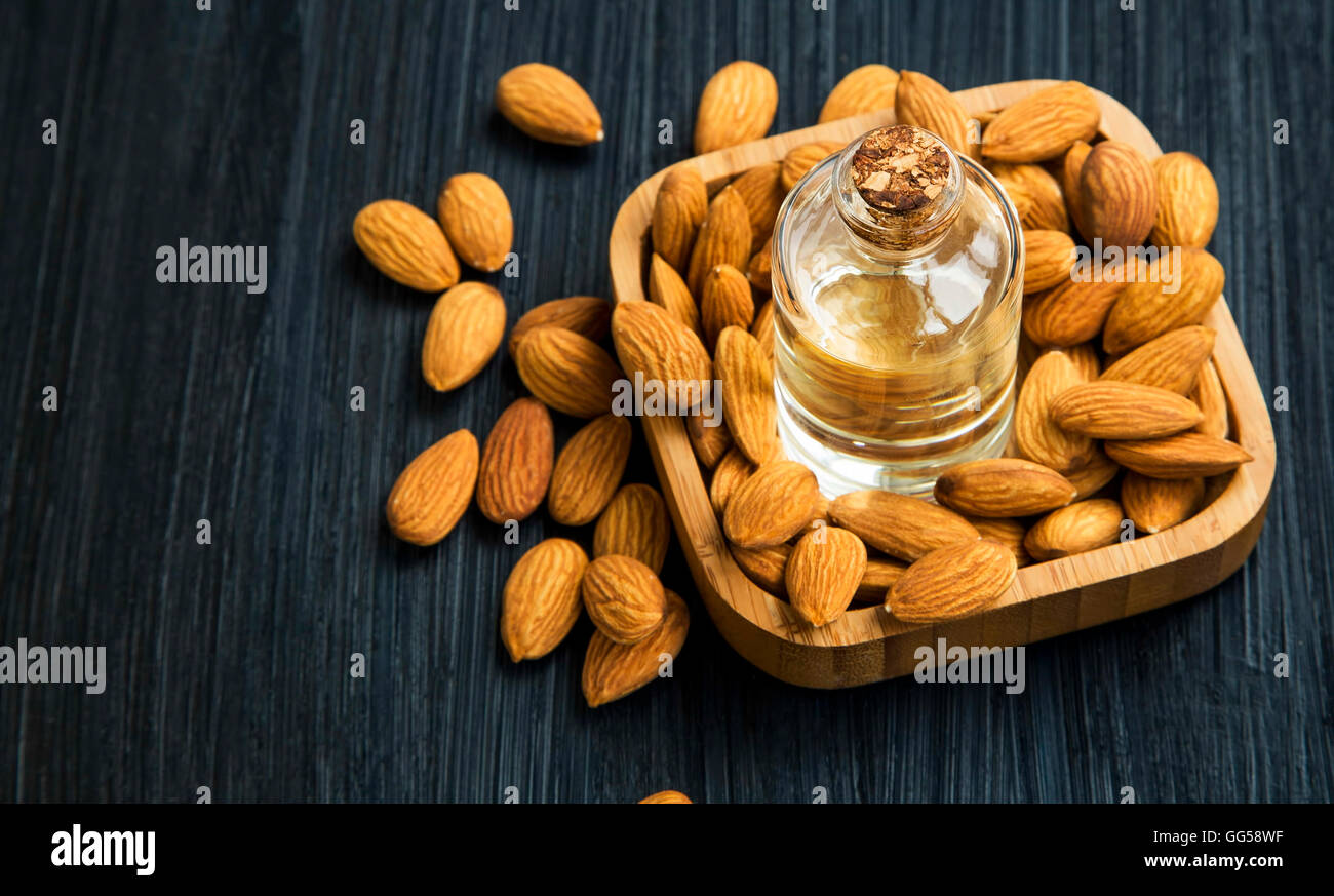 Almond oil bottle with nuts Stock Photo