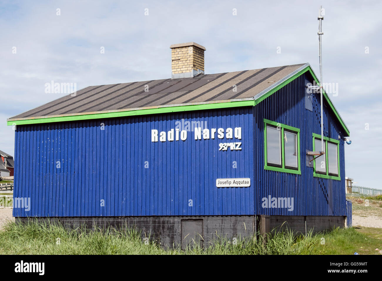 Blue wooden building housing local Radio Narsaq. Narsaq, Kujalleq, Southern Greenland Stock Photo