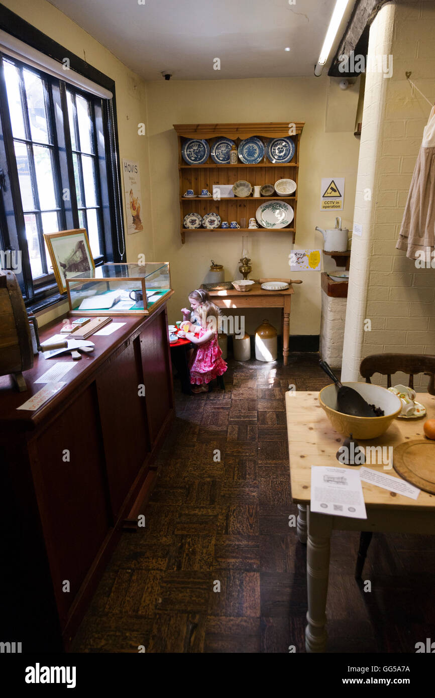 Child Plays In The Period Style Kitchen At The The Tudor