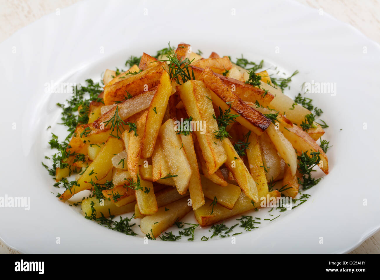 Roasted potato with dill and parsley Stock Photo Alamy