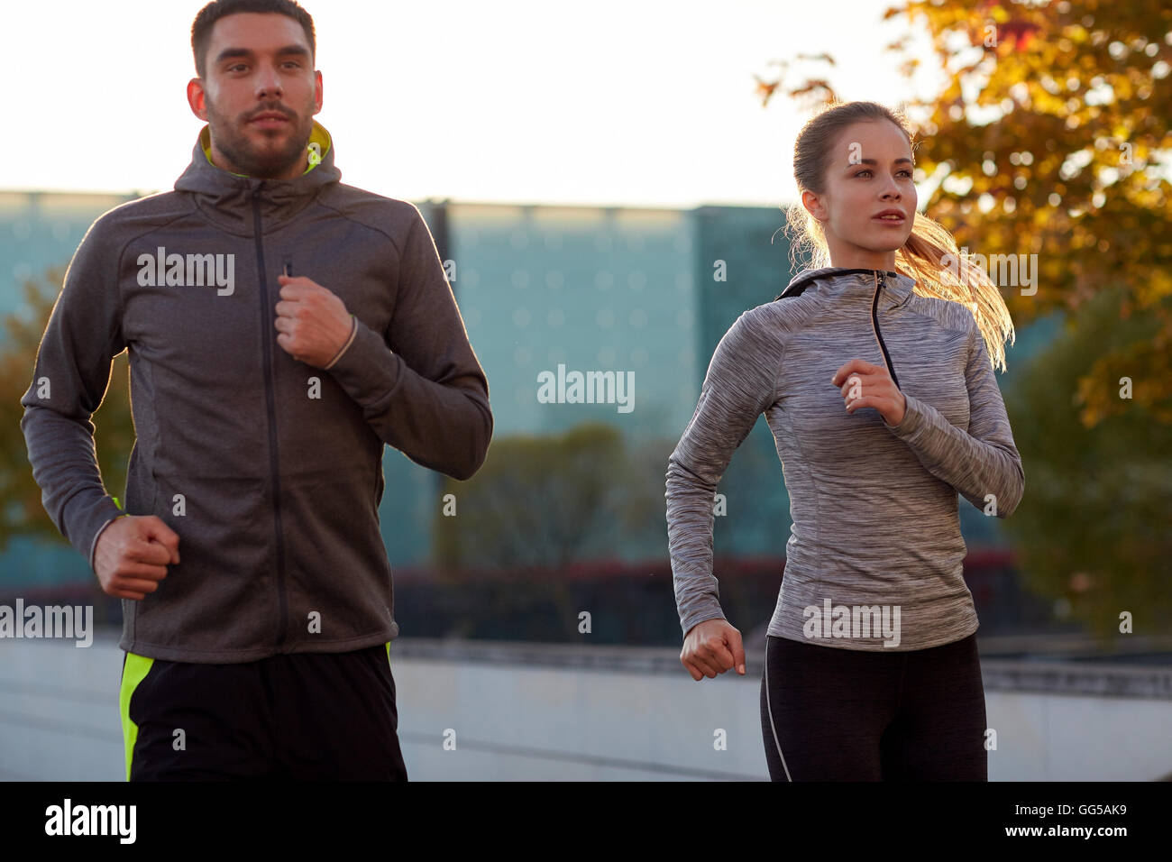 couple running outdoors Stock Photo - Alamy