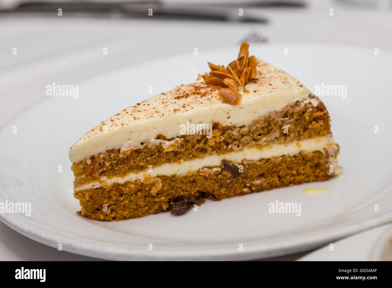 A slice of fresh carrot cake on a plate Stock Photo