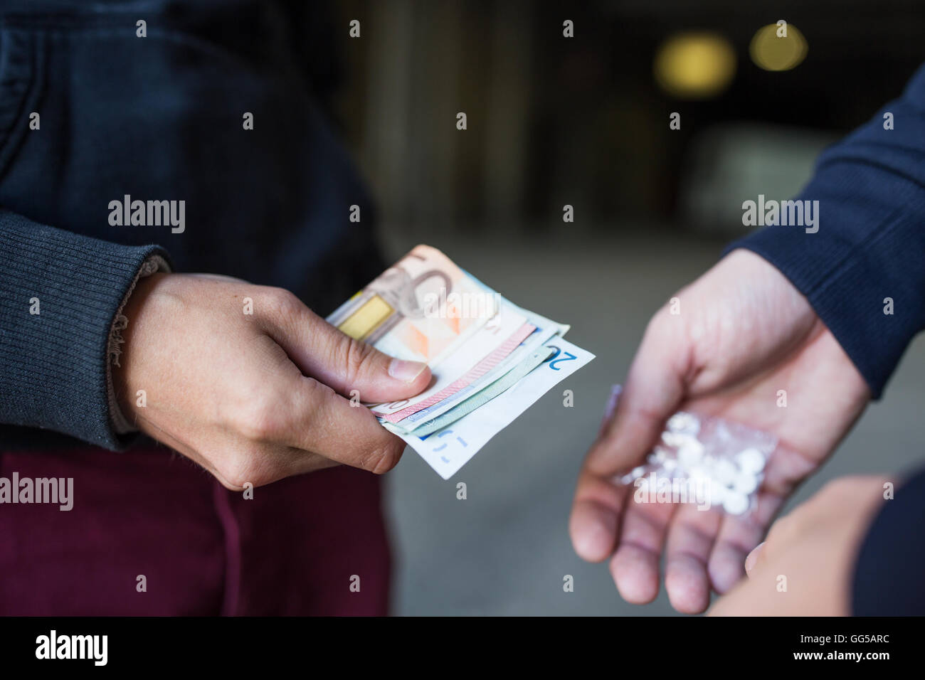 close up of addict buying dose from drug dealer Stock Photo