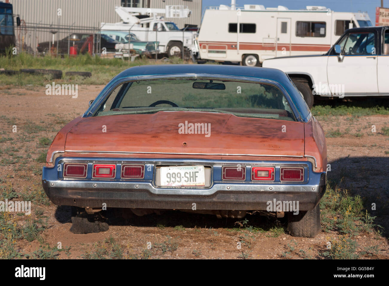 rusty classic American 1973 Chevrolet Caprice car in a junkyard Route