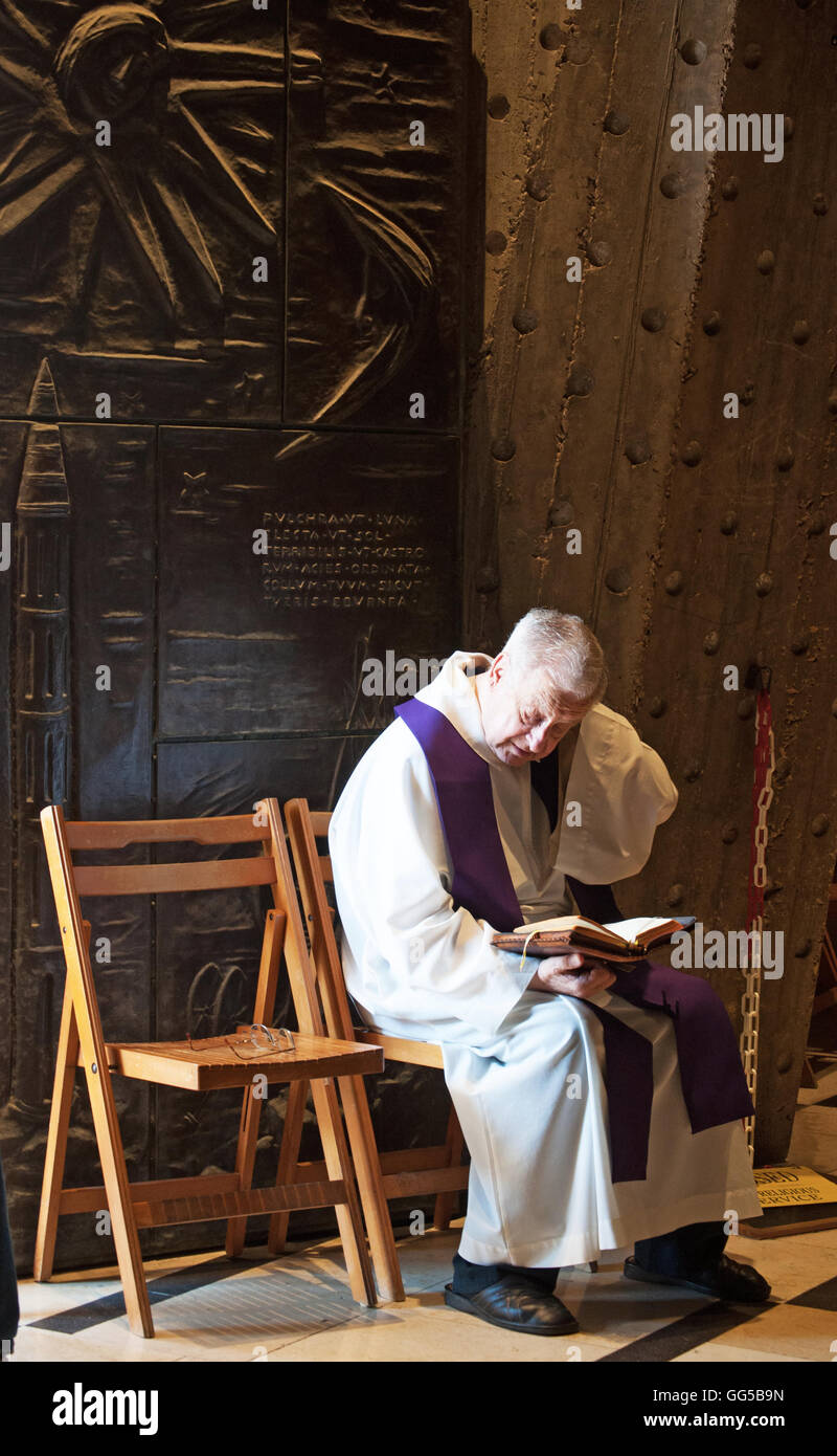Nazareth a priest seated on a chair the Church of the Annunciation, built over the believed