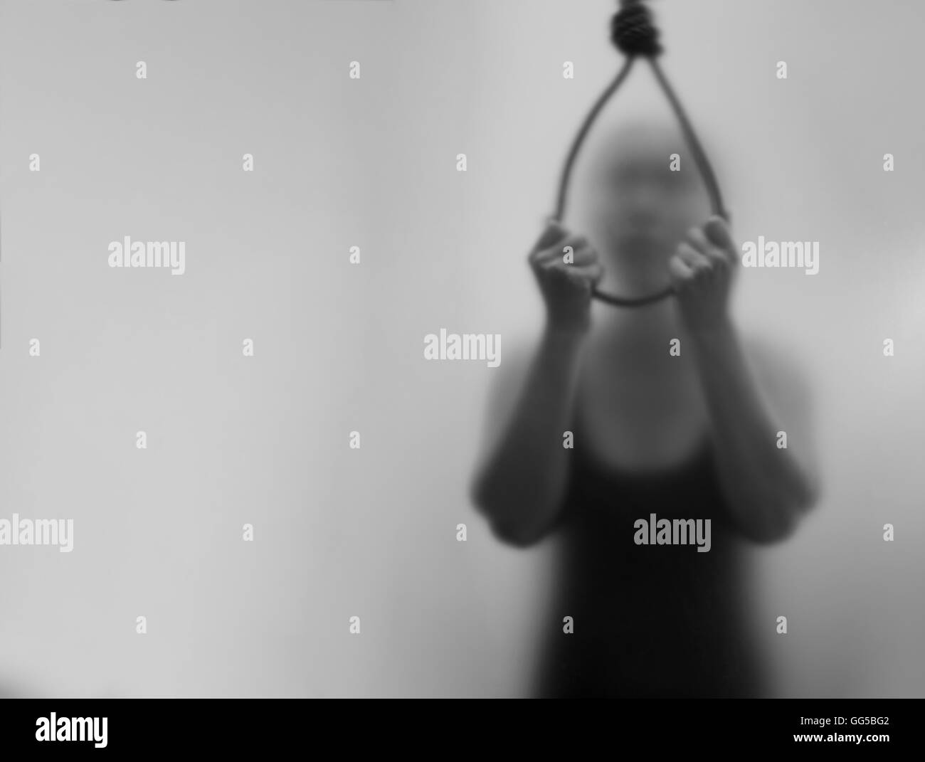 A woman hanging suicide. ,Dark Blur and noise concept. Stock Photo