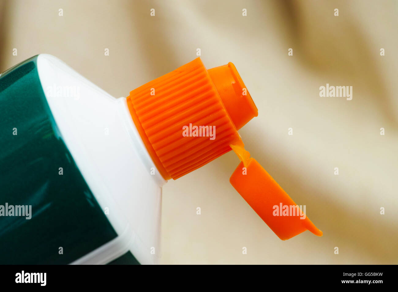 Open orange cap of toothpaste tube Stock Photo Alamy