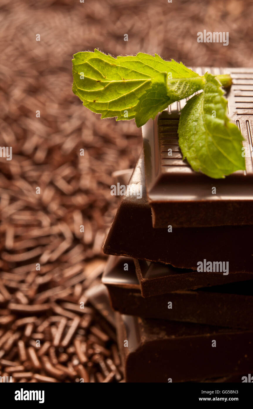 stack of chocolate pieces and leaf of mint Stock Photo