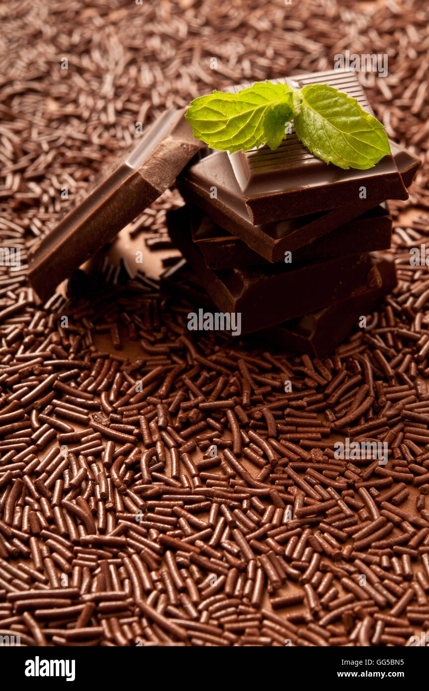 stack of chocolate pieces and leaf of mint Stock Photo