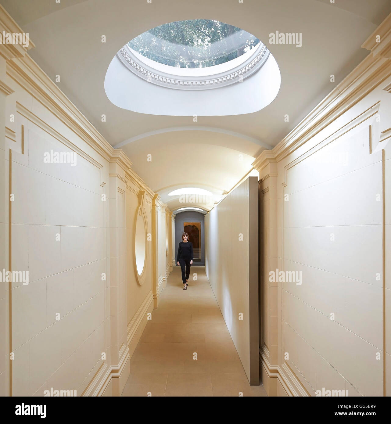 Corridor with circular skylight. The Garden Building  at Lincoln College, Oxford, United Kingdom. Architect: Stanton Williams, 2015. Stock Photo