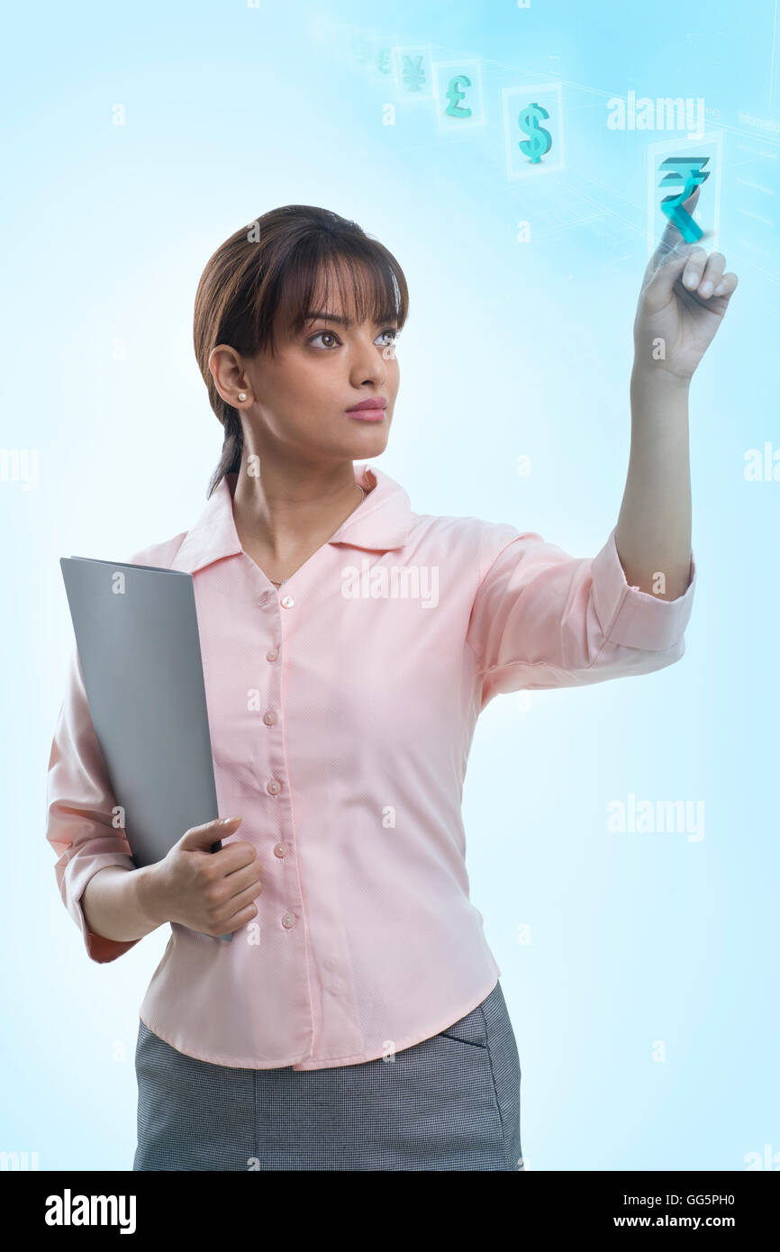 Confident young businesswoman using hi-tech computer monitor Stock Photo