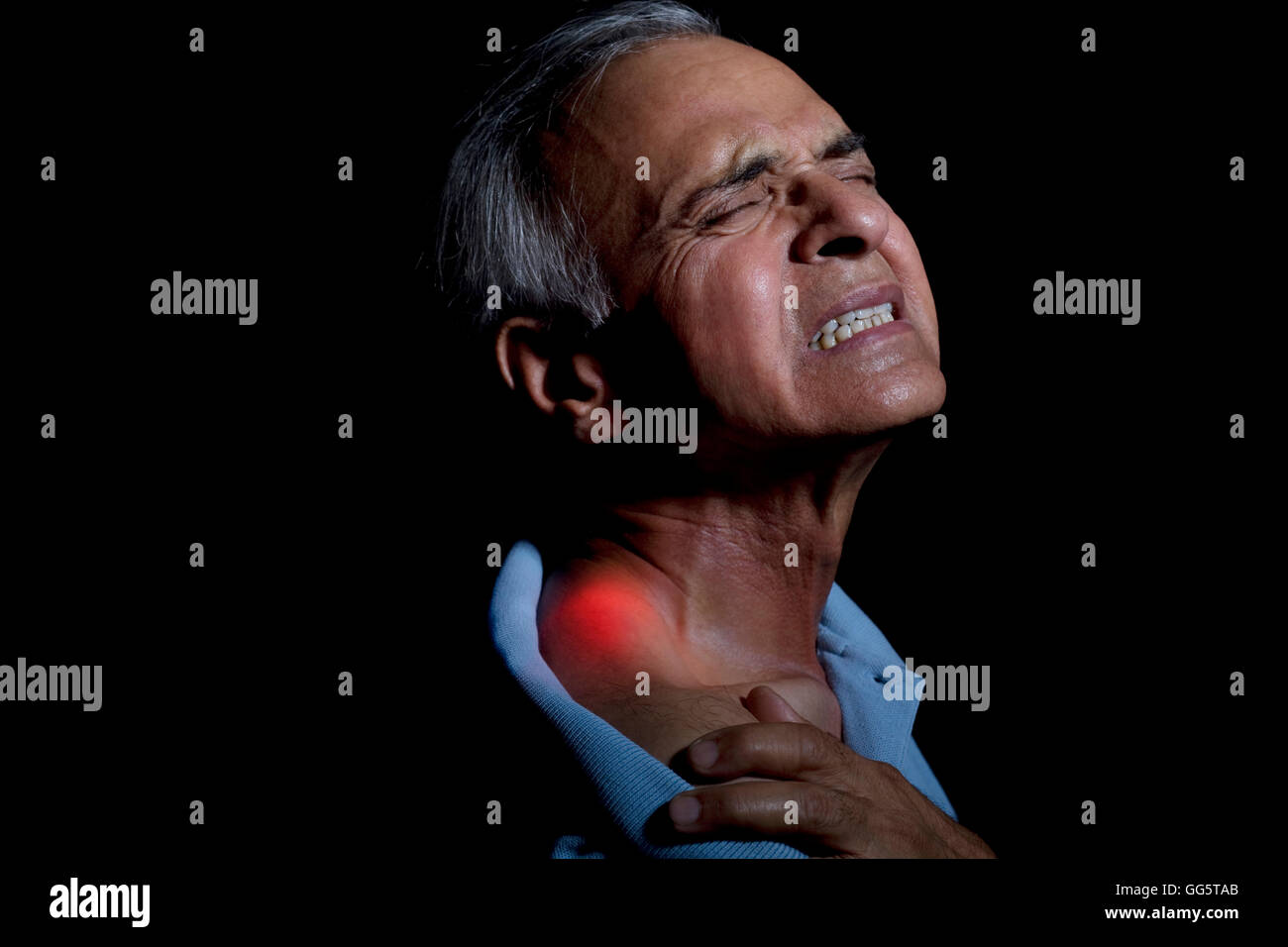 Close-up of an elderly man suffering from shoulder pain Stock Photo - Alamy