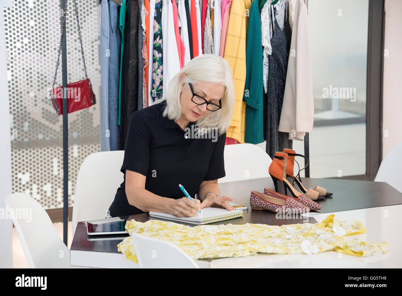 Female fashion designer working in her office Stock Photo