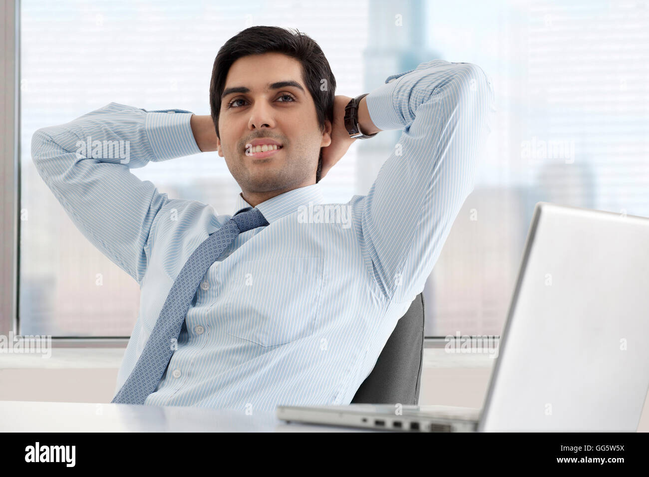 Relaxed young businessman with laptop hi-res stock photography and ...
