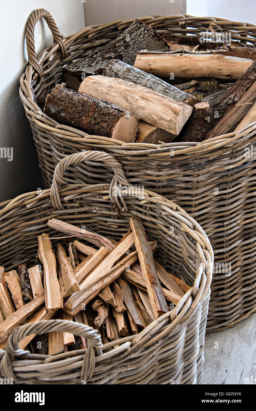 Firewood in basket at home Stock Photo