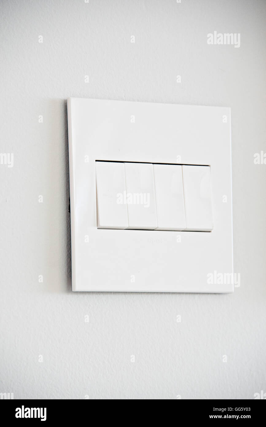 Close-up of light switches on wall Stock Photo