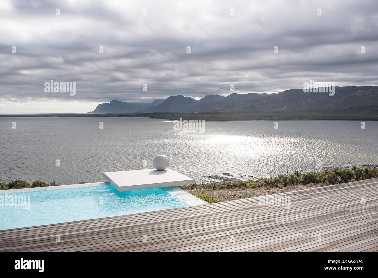 View of infinity pool at lakeside Stock Photo