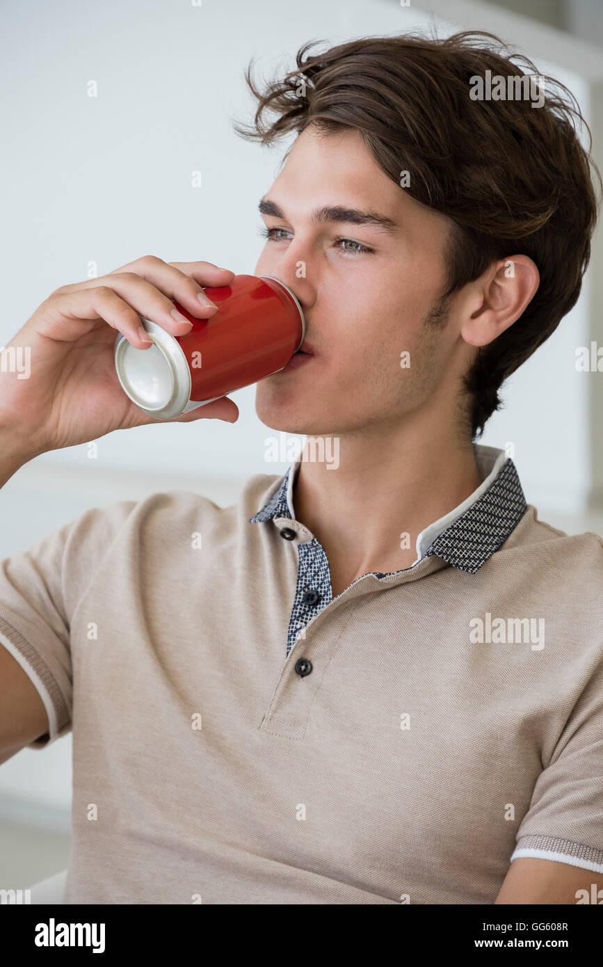 Closeup of a young man drinking soda Stock Photo Alamy