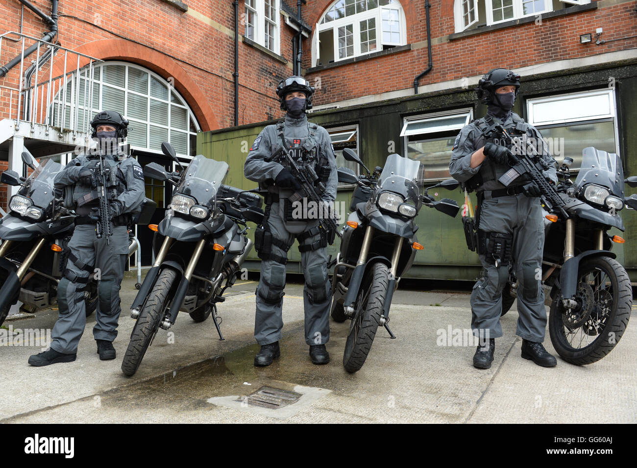 Armed police prepare to deploy from Hyde Park, central London, as Scotland Yard announced that the first of 600 additional armed officers were trained and operationally ready, and unveiled plans to put more marksmen on public patrol. Stock Photo