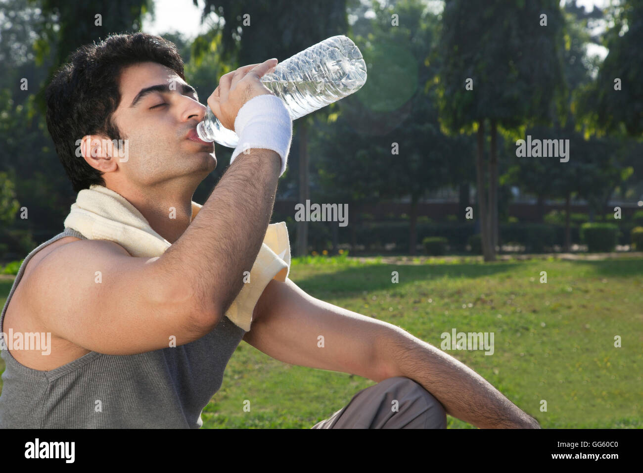 Young fit man drinking water after sport workout Stock Photo