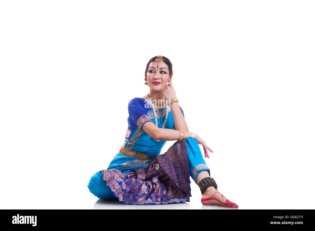 Dancer performing Bharatanatyam over white background Stock Photo