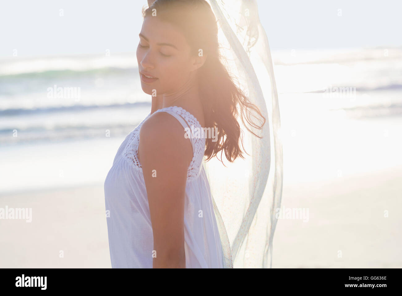 Attractive young woman posing on the beach Stock Photo - Alamy