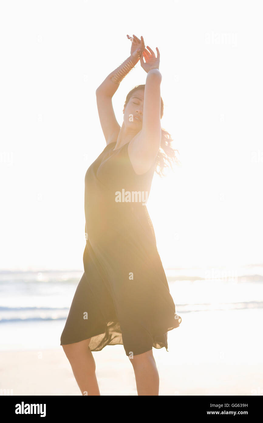 Beautiful young woman posing on the beach Stock Photo - Alamy