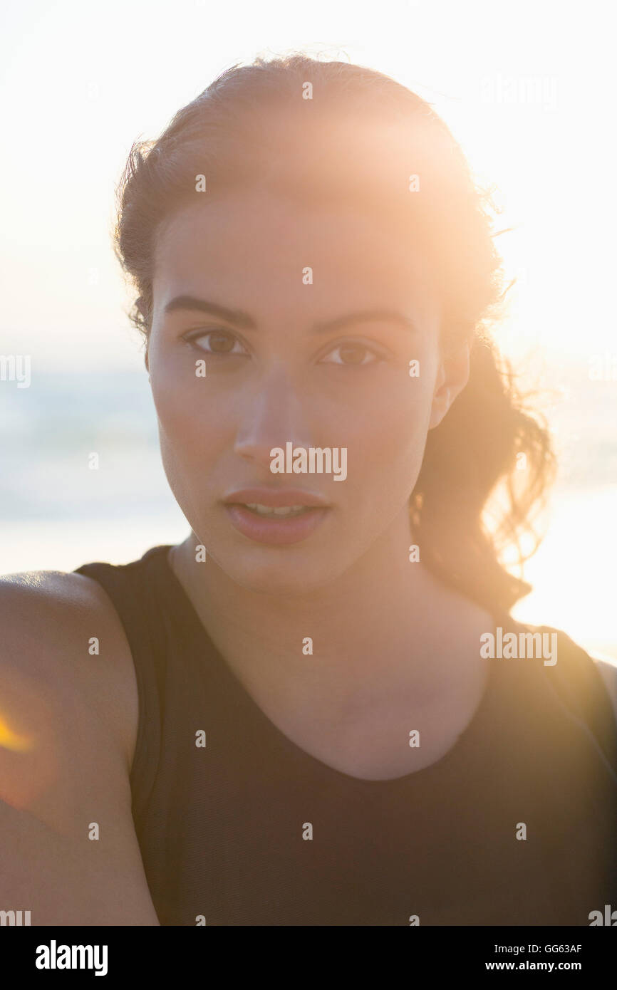 Portrait of a beautiful young woman standing on the beach Stock Photo ...