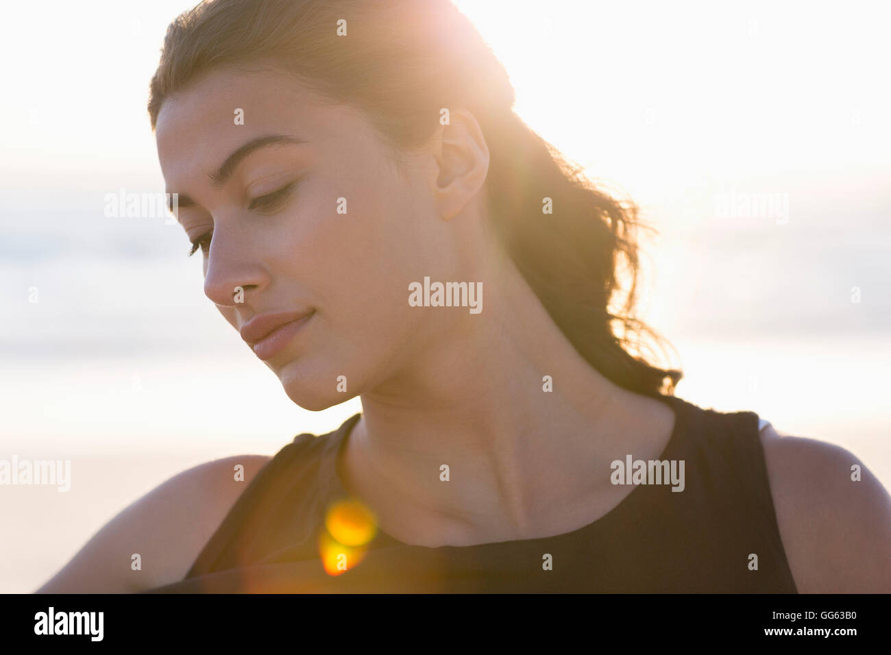 Beautiful young woman posing on the beach Stock Photo - Alamy