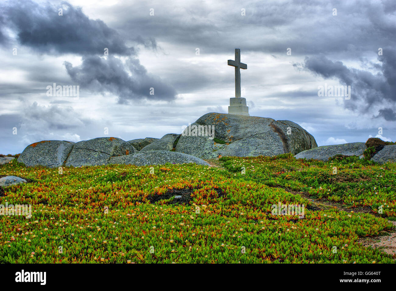 Cross on top of the granite rocks near the beach, north of Portugal Stock Photo