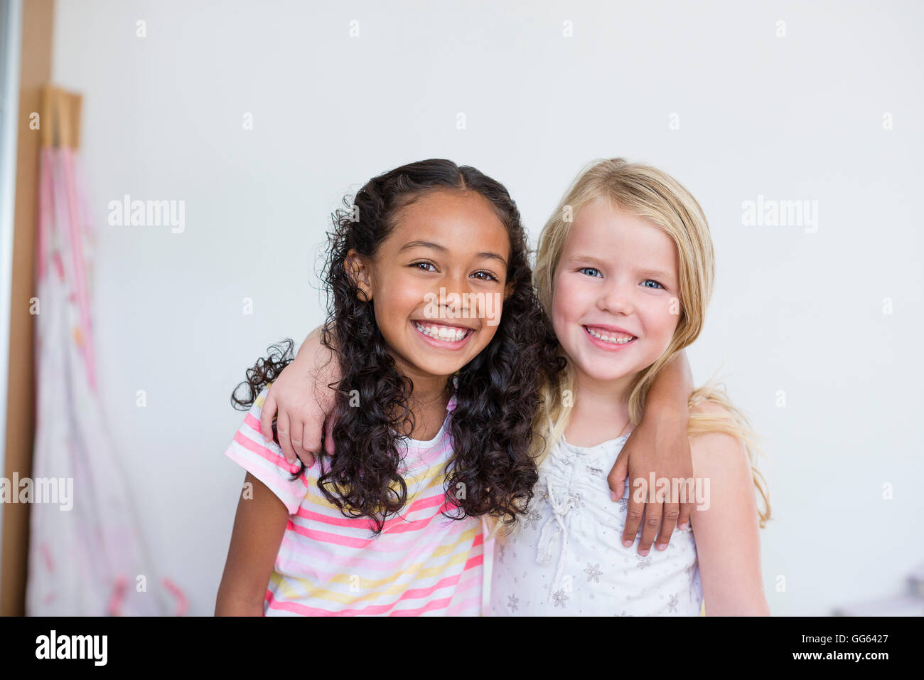 Portrait of two little girls smiling Stock Photo - Alamy