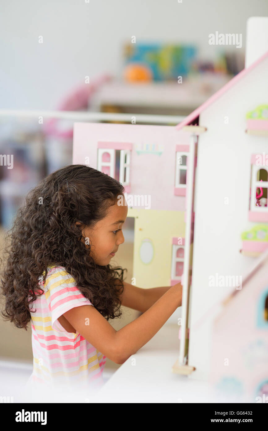 Girl playing with dolls house hi-res stock photography and images - Alamy