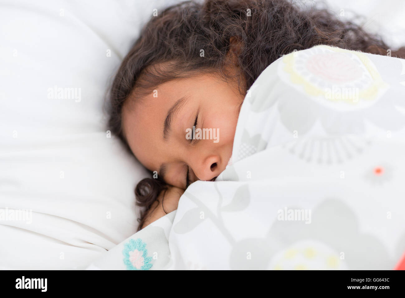 Little girl sleeping on the bed Stock Photo - Alamy
