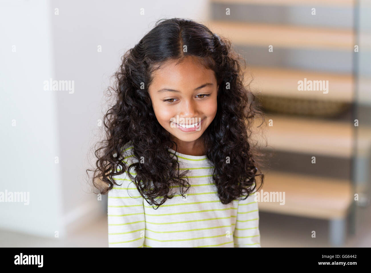 Close-up of a happy little girl smiling at home Stock Photo - Alamy