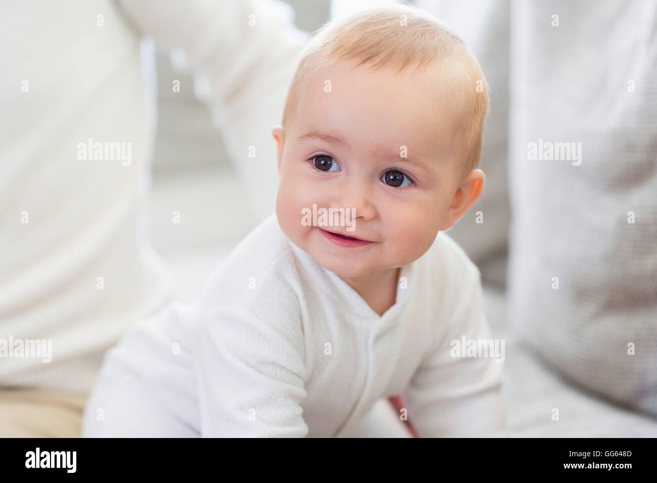 Happy baby girl with his father on couch Stock Photo