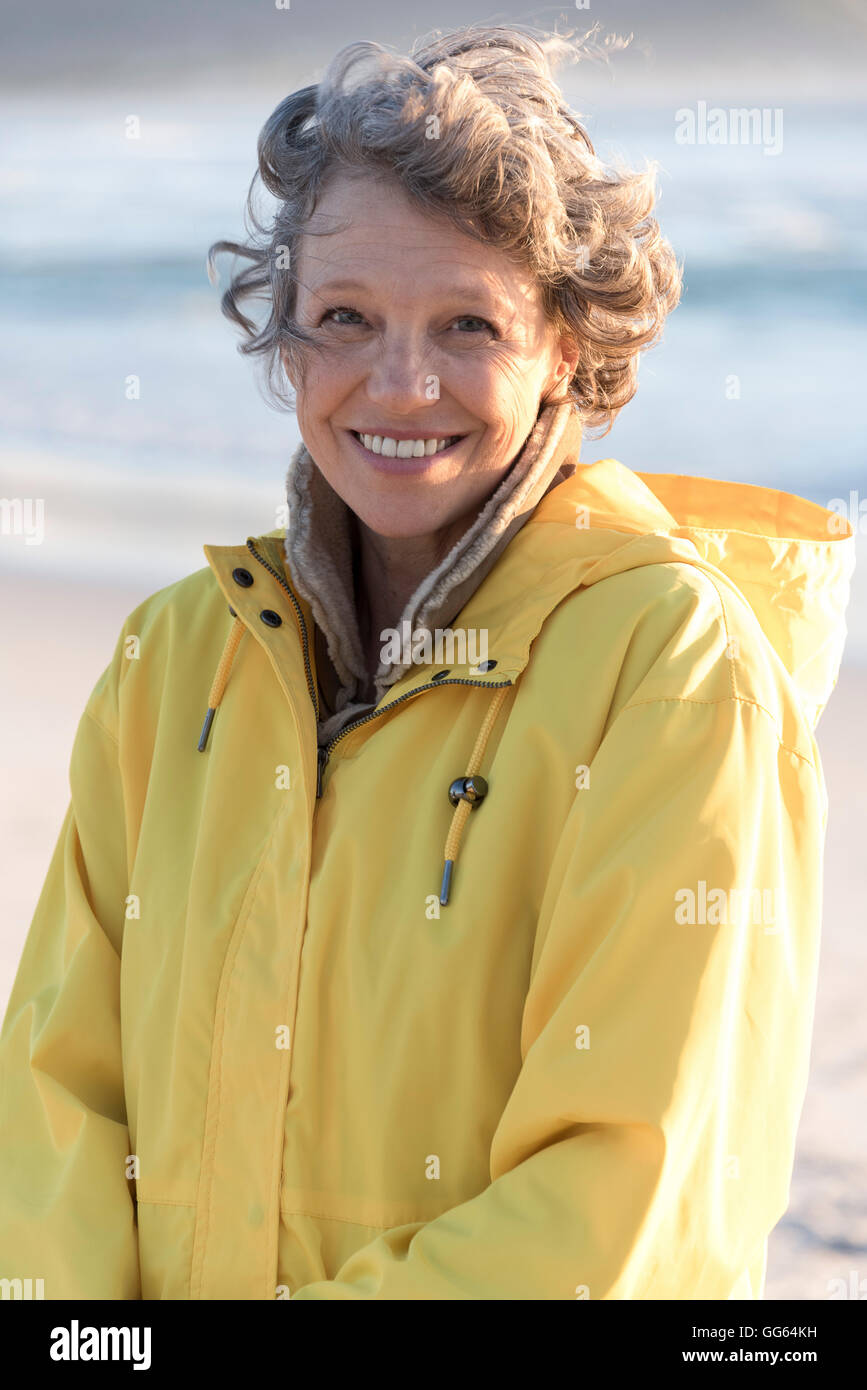 Portrait of happy mature woman smiling on the beach Stock Photo - Alamy