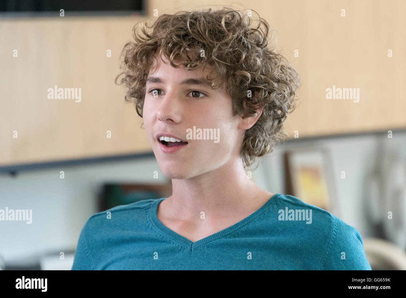Happy teenage boy smiling Stock Photo - Alamy