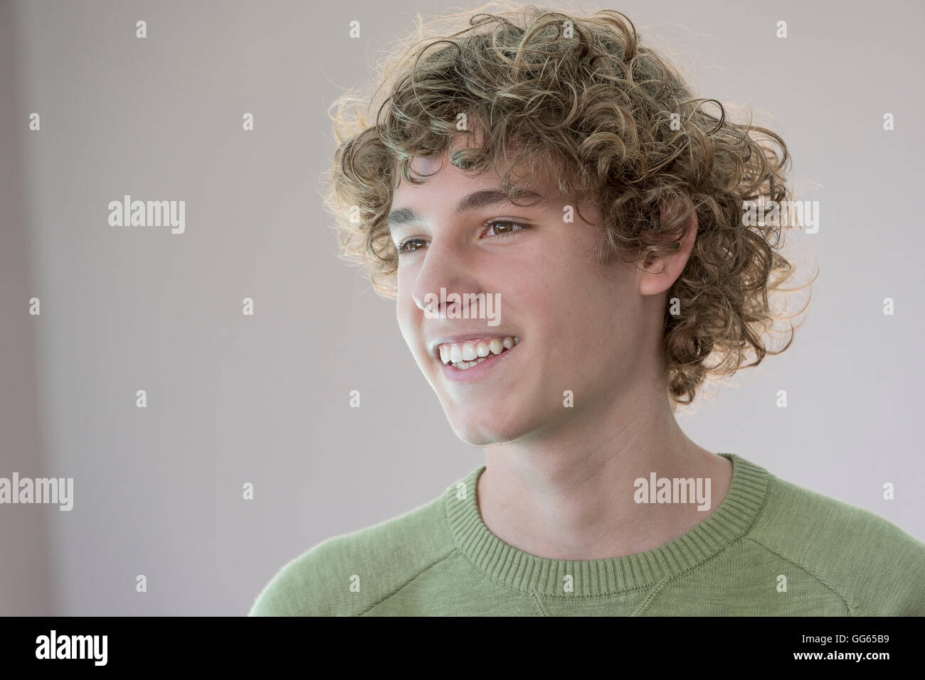 Happy teenage boy smiling Stock Photo - Alamy
