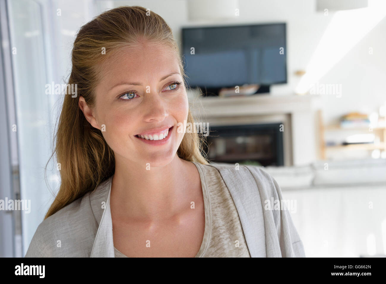 Woman home smiling on front hi-res stock photography and images - Alamy